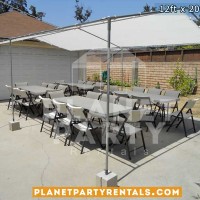 12ft x 20ft white party tent with white rectangular tables and white plastic chairs