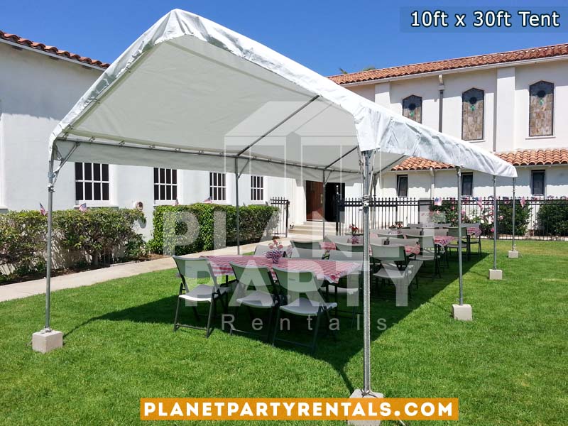 10ft x 30ft Party Tent shown with rectangular tables and plastic white chairs
