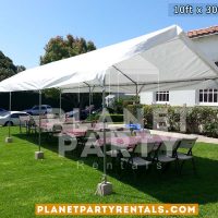 10ft x 30ft Party Tent shown with rectangular tables and plastic white chairs