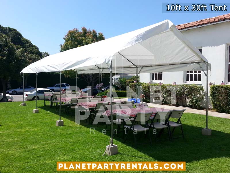 10ft x 30ft Party Tent shown with rectangular tables and plastic white chairs