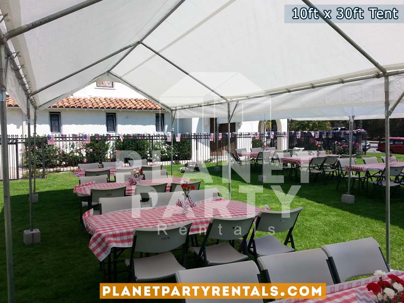 10ft x 30ft Party Tent shown with rectangular tables and plastic white chairs